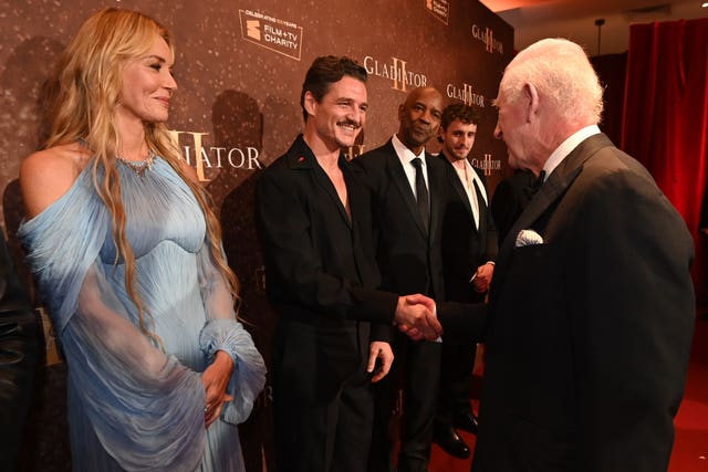 The King meets Pedro Pascal whilst attending the Royal Film Performance of Gladiator II on Wednesday evening 