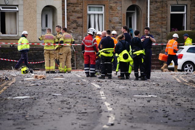 Emergency personnel at the scene after reports of a suspected gas explosion at a property on the junction of Clydach Road and Field Close in Morriston, Swansea