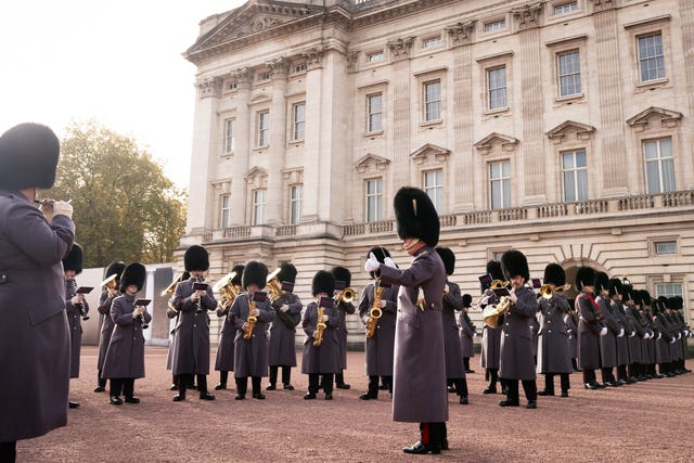 The Band and Bugles of The Rifles performing on the palace forecourt