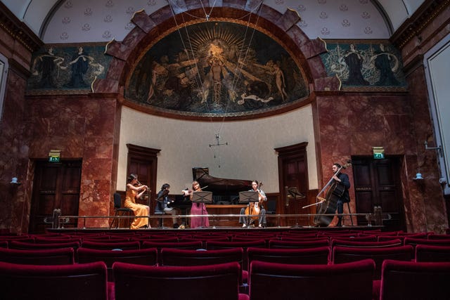 Musicians rehearse for a live concert on Saturday