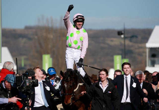 Ruby Walsh celebrates his victory on Douvan in the Supreme Novices' Hurdle at Cheltenham