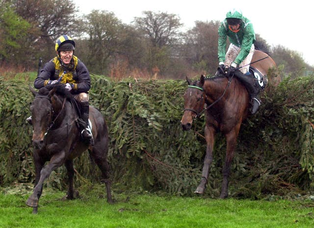 Sir AP McCoy on Blowing Wind (left) having remounted to finish third in 2001 