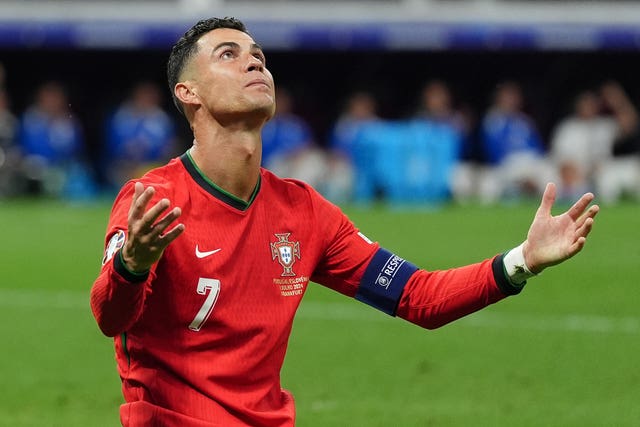 Portugal’s Cristiano Ronaldo holds out his arms after missing a chance