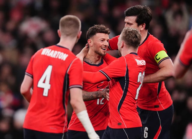 Ben White, centre, celebrates his goal