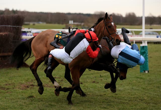 Pendleton, left, falls off Pacha Du Polder during the Betfair Switching Saddles ‘Grassroots’ Fox Hunters’ Chase at Fakenham