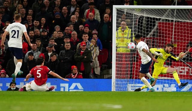 Harry Maguire, second left, scores an own goal