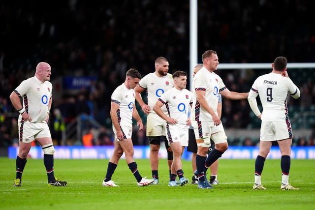 England players leave the field looking dejected 