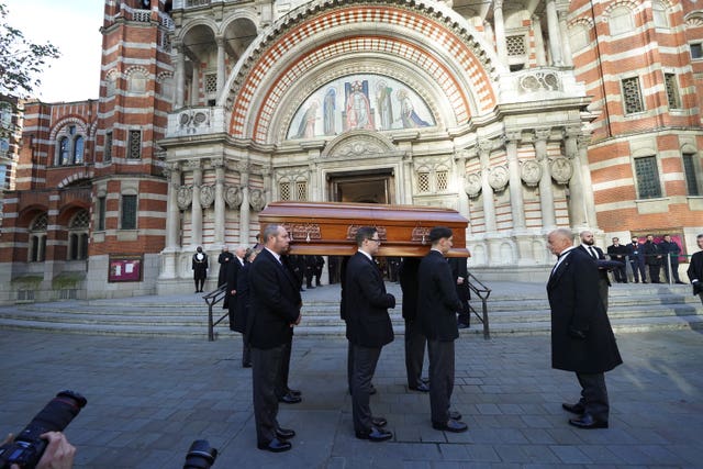 Pall bearers carry the coffin of Sir David Amess into Westminster Cathedral