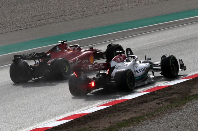 Carlos Sainz (left) and Lewis Hamilton jostle for position during testing