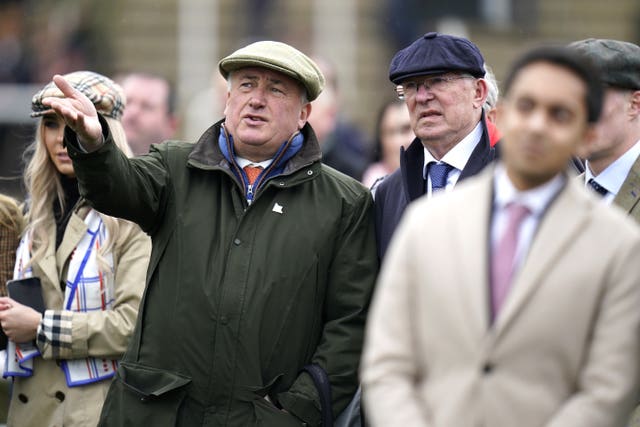 Sir Alex Ferguson (right) and Paul Nicholls watch the Ballymore Novices' Hurdle at the Cheltenham Festival 