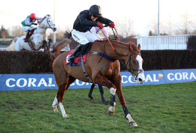 Lieutenant Rocco ridden by Thomas Bellamy clears a fence before winning the Coral Bet Bundles Handicap Chase at Kempton Park