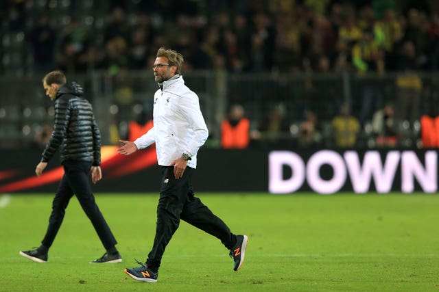 Thomas Tuchel and Jurgen Klopp walk off the pitch in different directions