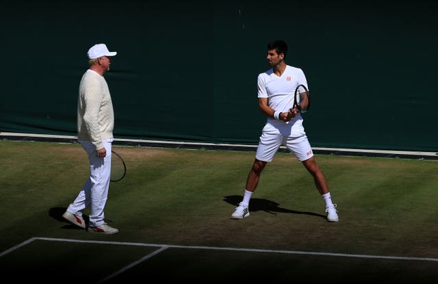 Novak Djokovic practices with coach Boris Becker at Wimbledon