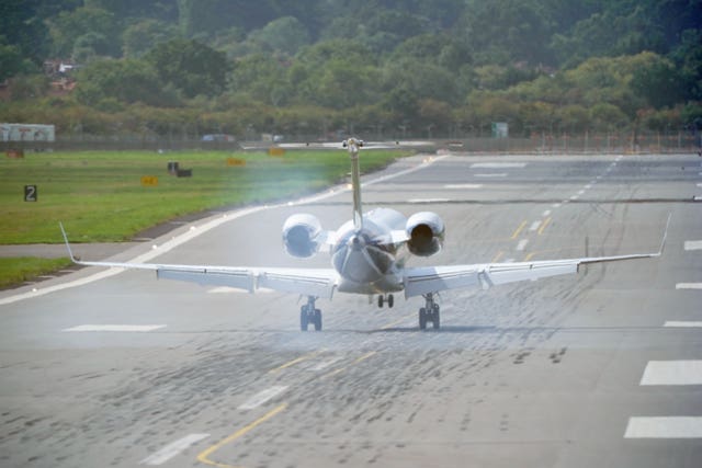 The plane carrying King Charles III and the new Queen touches down at RAF Northolt in London