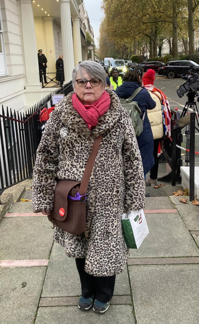 A woman in a leopard-print coat