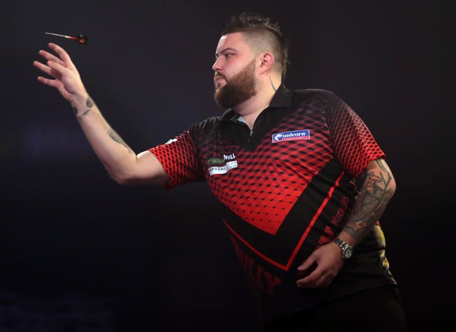 Michael Smith, pictured, was knocked out in the second round by Lowe (Adam Davy/PA)