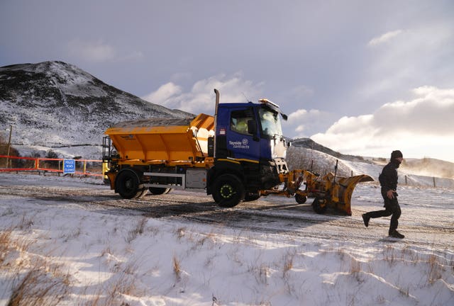 A snow plough clears the road