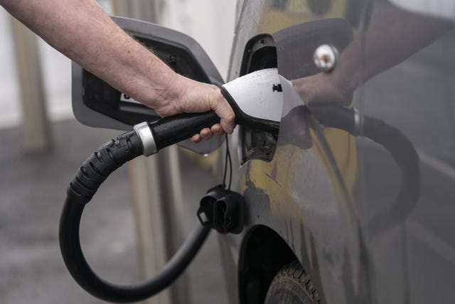 A person charging their electric car