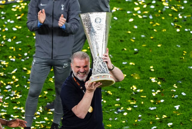 Ange Postecoglou lifts the Europa League trophy after Tottenham's win in the final against Manchester United