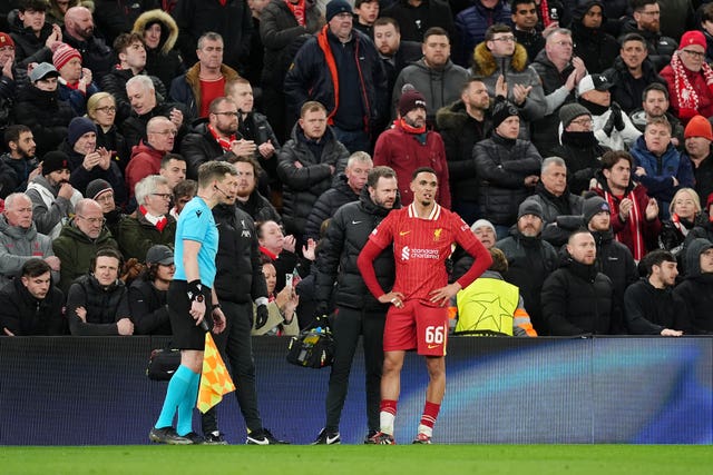 Liverpool's Trent Alexander-Arnold stands injured on the touchline against Paris St Germain