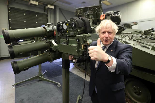 Boris Johnson with a Mark 3 shoulder launch LML missile system, at Thales weapons manufacturer in Belfast