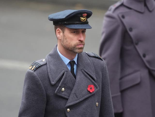 William in an RAF cap and grey military overcoat on Remembrance Sunday