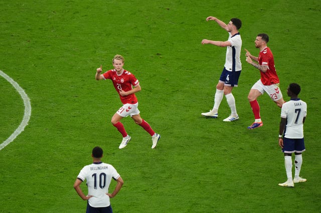 Denmark’s Morten Hjulmand celebrates his goal as England players look unhappy