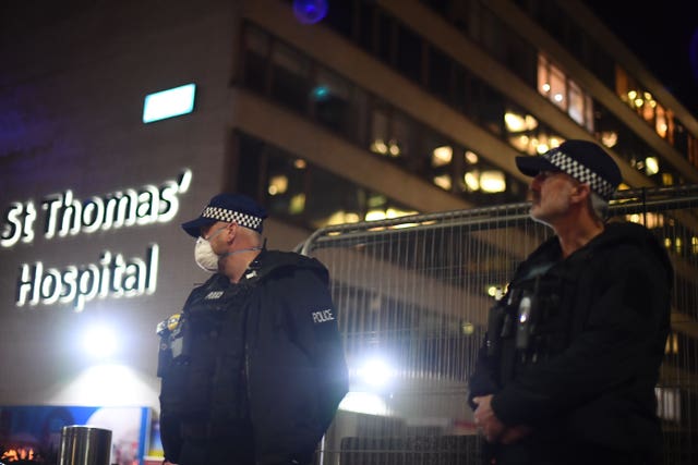 Police officers outside St Thomas’ Hospital in central London while Prime Minister Boris Johnson was in intensive care (Victoria Jones/PA)