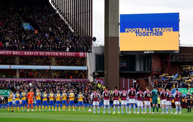 Players from Aston Villa and Southampton stand for a moment of reflection and solidarity with Ukraine