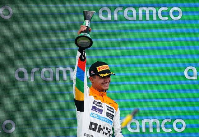 McLaren’s Lando Norris celebrates with his trophy for second on the podium after the British Grand Prix 2023 