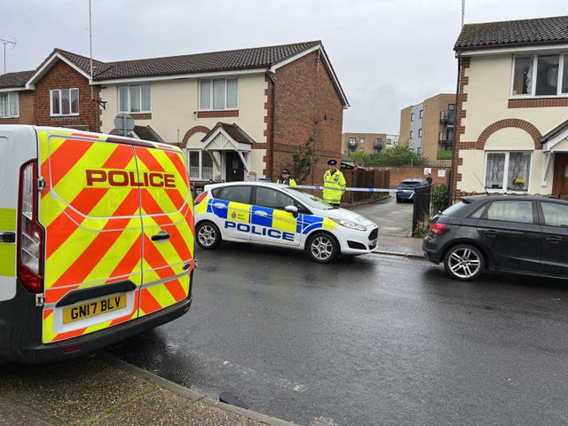 Police officers at the scene in Priory Road, Dartford