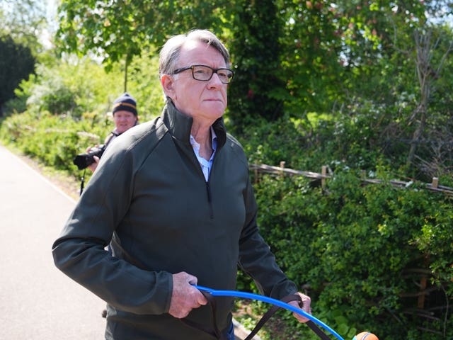 Peter Mandelson walking his dog