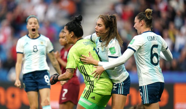 Argentina goalkeeper Vanina Correa celebrates after saving a penalty from Nikita Parris