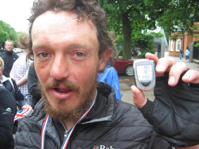Mike Hall with his pedometer at Greenwich Royal Observatory in south-east London after he won a round-the-world bike race. (Lizzie Edmonds/PA)