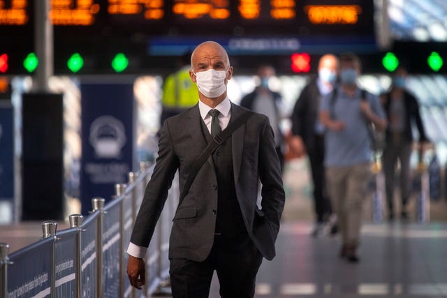 Passengers wearing face masks at Waterloo station 