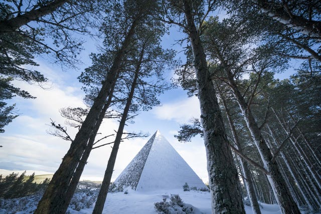 A large cairn covered in ice and snow