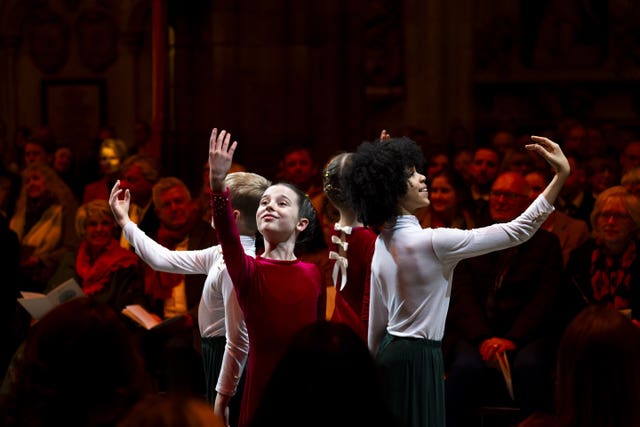 Four young ballet dancers dressed in red and white 