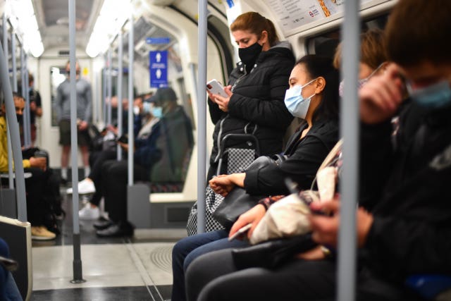 Commuters on a Jubilee line London Underground train
