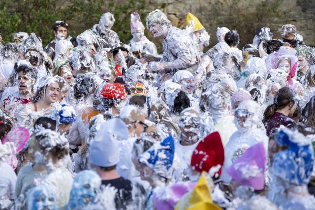 Students covered in shaving foam