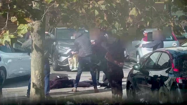 Video still showing Alfie Coleman on the ground outside a Morrisons supermarket