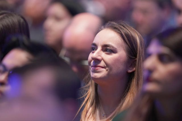 Meghan Gallacher smiling while seated in an audience