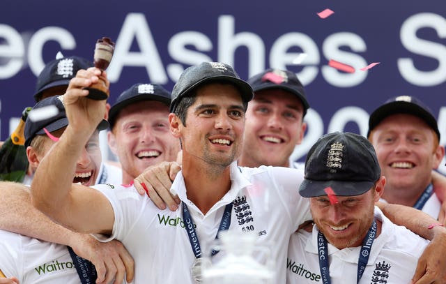 Alastair Cook celebrates with the Ashes urn