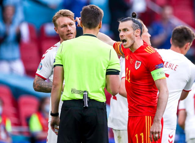 Gareth Bale argues with referee Daniel Siebert after Kasper Dolberg put Denmark 2-0 up 