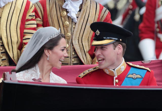 Newlywed William and Kate in the carriage procession after Westminster Abbey 