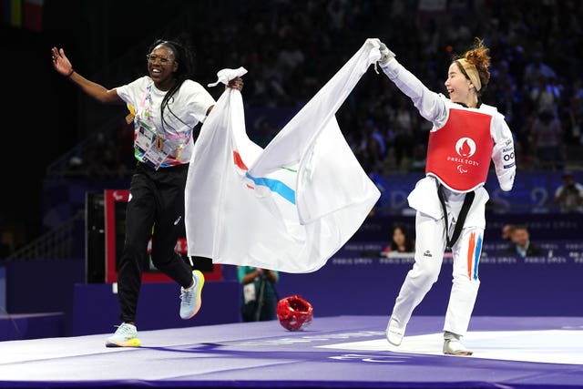 Zakia Khudadadi celebrates victory in the women K44 -47kg bronze medal contest