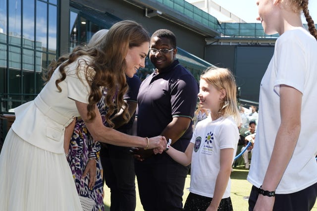 Kate shakes hands with Lydia Lowe 