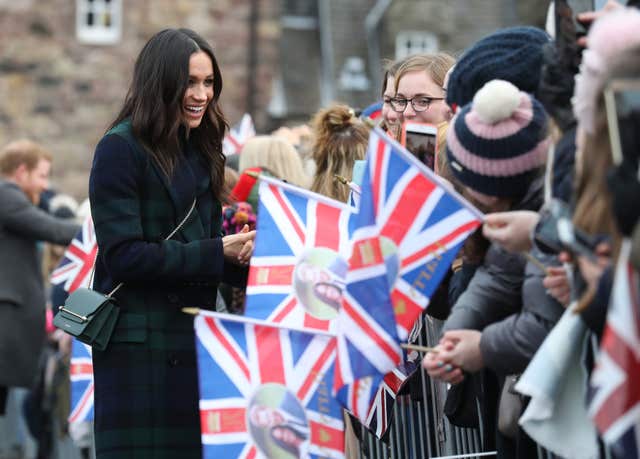 Meghan Markle meets crowds of well-wishers during a walkabout on the esplanade at Edinburgh Castle