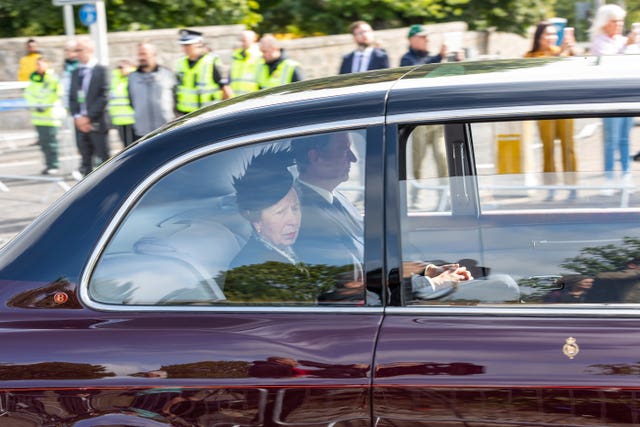 The Princess Royal and her husband Admiral Sir Tim Laurence travelled behind the hearse on its journey to Edinburgh