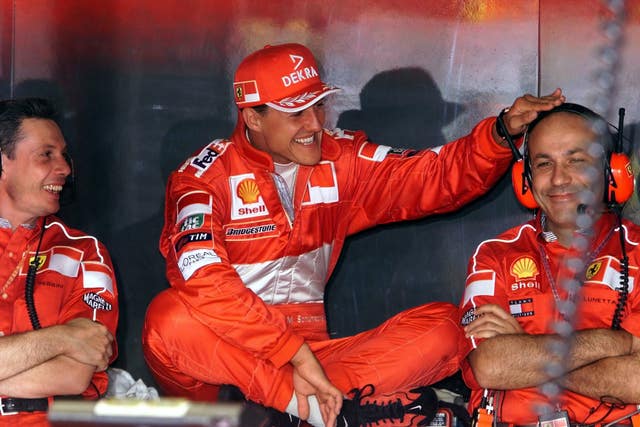German driver Michael Schumacher shares a joke with some of his team in 1999. Seven-time world champion Schumacher was a Silverstone winner in 1998, 2002 and 2004