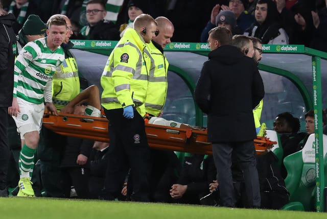 Celtic's Emillio Izaguirre was carried off after the tackle by Darnell Johnson 